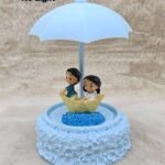 Couple Boat Umbrella Showpiece